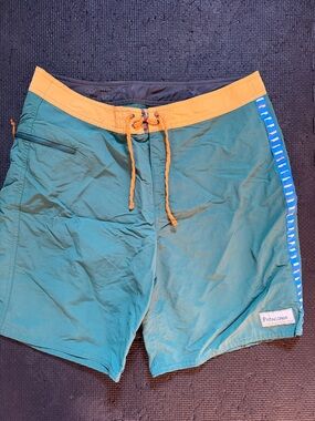 Patagonia Teal Swim Board Shorts with Yellow Waistband and Blue Side Accents
